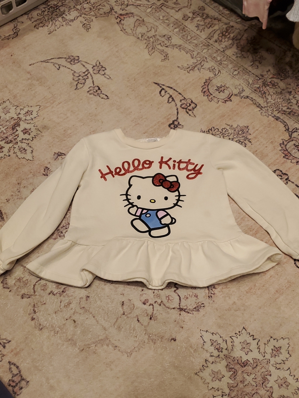 Hello Kitty Cream Ruffle Hem Sweatshirt with Red Glitter Logo